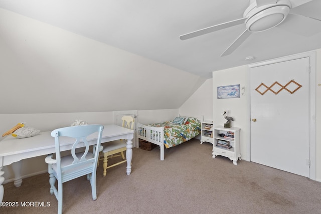 bedroom with a ceiling fan, vaulted ceiling, and carpet floors