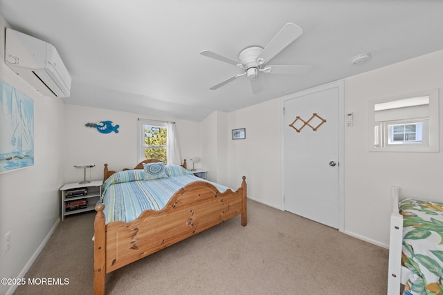 carpeted bedroom with a wall mounted AC, baseboards, and a ceiling fan