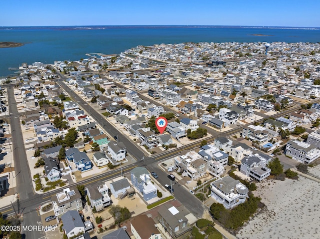 aerial view featuring a residential view and a water view
