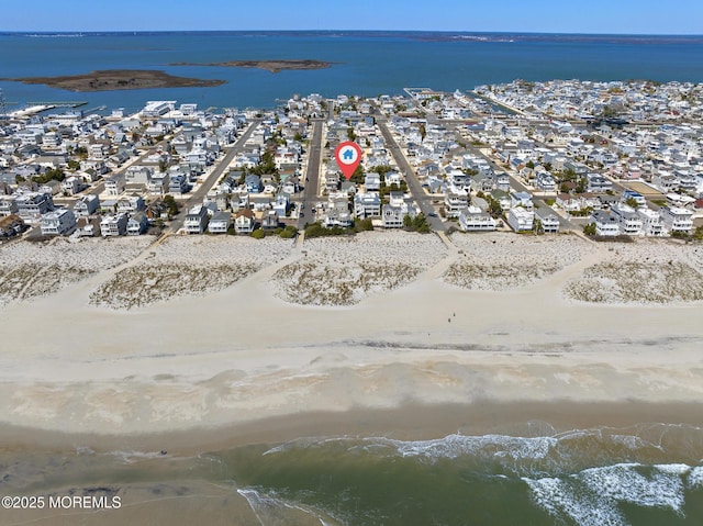 bird's eye view featuring a water view, a residential view, and a beach view