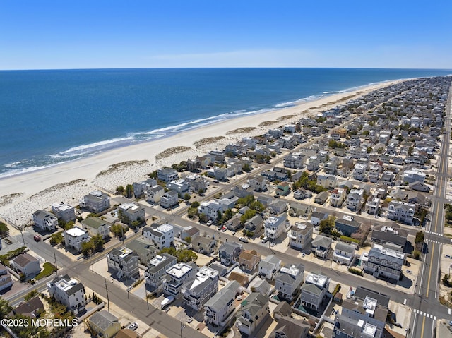 aerial view featuring a water view, a residential view, and a view of the beach