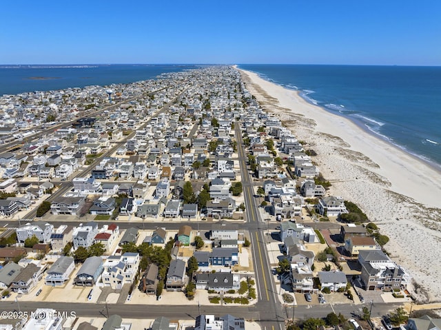 bird's eye view featuring a beach view, a residential view, and a water view