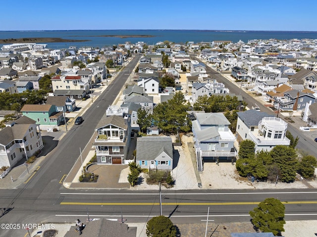bird's eye view with a water view and a residential view