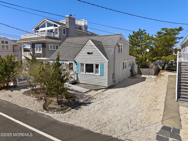 view of front of home featuring a shingled roof