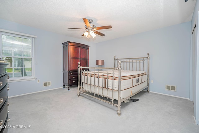 13 Gatley Close Unit 1000, Freehold, NJ 07728 - bedroom with visible vents, light colored carpet, baseboards, and a textured ceiling