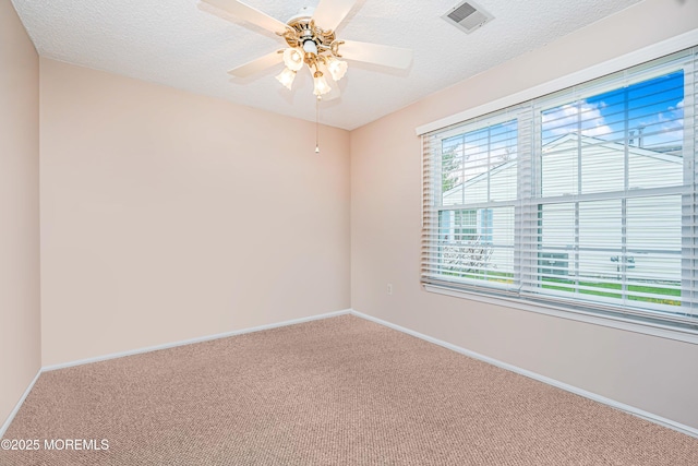 13 Gatley Close Unit 1000, Freehold, NJ 07728 - carpeted spare room featuring visible vents, baseboards, and a textured ceiling