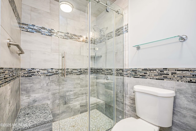 13 Gatley Close Unit 1000, Freehold, NJ 07728 - bathroom with a wainscoted wall, a stall shower, tile walls, and toilet
