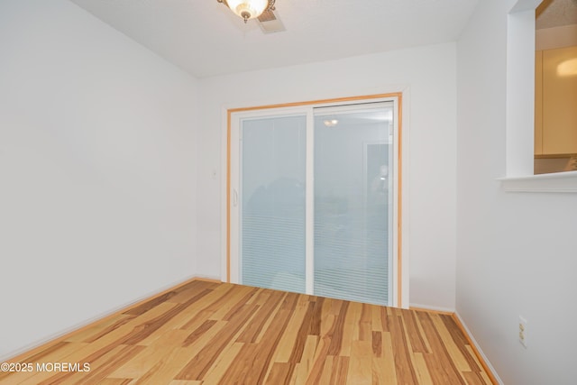 13 Gatley Close Unit 1000, Freehold, NJ 07728 - empty room featuring baseboards and wood finished floors