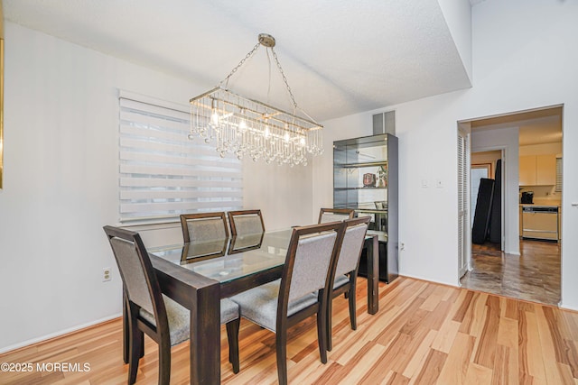 13 Gatley Close Unit 1000, Freehold, NJ 07728 - dining area featuring light wood-style floors, visible vents, and an inviting chandelier