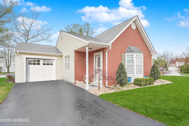 13 Gatley Close Unit 1000, Freehold, NJ 07728 - view of side of home with a lawn, roof with shingles, brick siding, a garage, and driveway