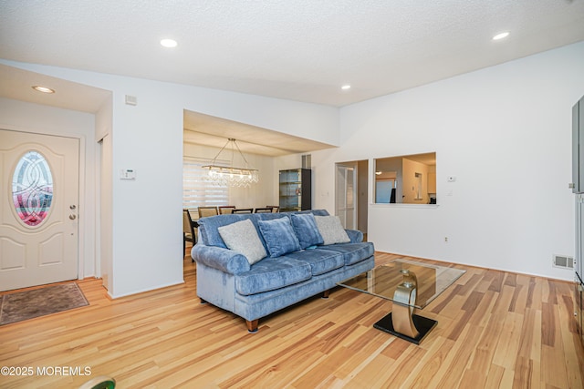 13 Gatley Close Unit 1000, Freehold, NJ 07728 - living area with wood finished floors, visible vents, and recessed lighting