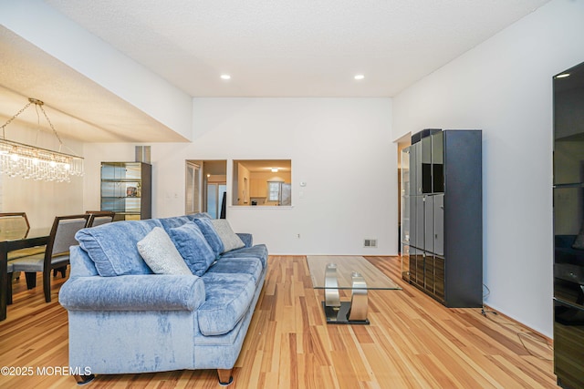 13 Gatley Close Unit 1000, Freehold, NJ 07728 - living area with a chandelier, wood finished floors, visible vents, and recessed lighting