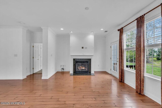 3 Marlborough Ct, Jackson, NJ 08527 - unfurnished living room featuring ornamental molding, baseboards, light wood-type flooring, and a fireplace with flush hearth