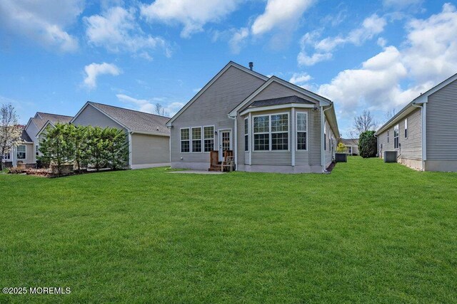 3 Marlborough Ct, Jackson, NJ 08527 - rear view of house with a yard, entry steps, and central AC