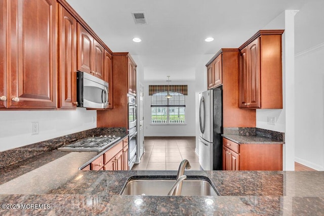 3 Marlborough Ct, Jackson, NJ 08527 - kitchen featuring dark stone counters, visible vents, a sink, stainless steel appliances, and baseboards