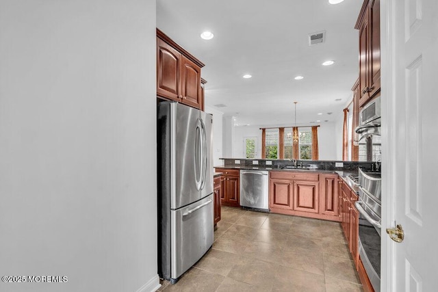 3 Marlborough Ct, Jackson, NJ 08527 - kitchen with a peninsula, recessed lighting, appliances with stainless steel finishes, dark countertops, and a sink