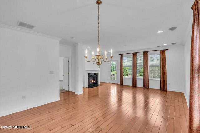 3 Marlborough Ct, Jackson, NJ 08527 - unfurnished living room featuring visible vents, baseboards, a notable chandelier, ornamental molding, and a fireplace with flush hearth