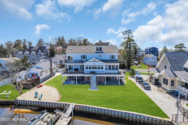 1417 Holmes Ave, Toms River, NJ 08753 - rear view of property with a residential view, a yard, a deck with water view, stairway, and a patio area