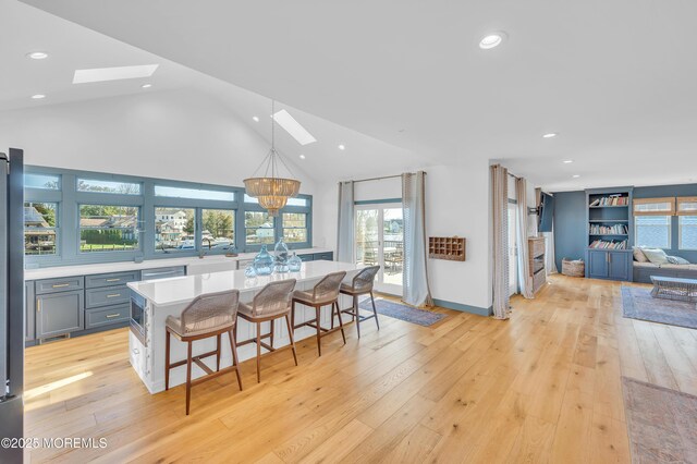 1417 Holmes Ave, Toms River, NJ 08753 - dining area with a skylight, healthy amount of natural light, recessed lighting, light wood finished floors, and a chandelier