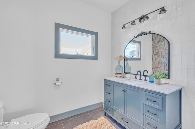 1417 Holmes Ave, Toms River, NJ 08753 - bathroom with toilet, vanity, tile patterned flooring, and baseboards