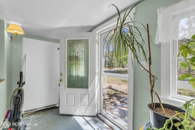 entrance foyer with plenty of natural light and concrete floors