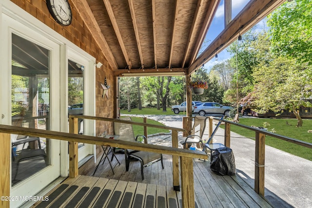 wooden deck with a yard