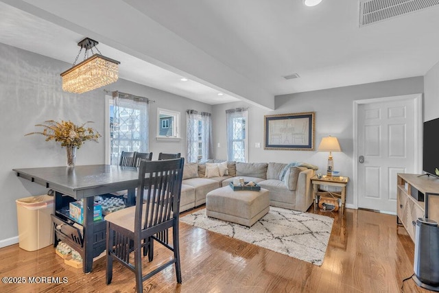19 Gravelly Point Rd, Highlands, NJ 07732 - living area featuring wood finished floors, recessed lighting, baseboards, and a chandelier