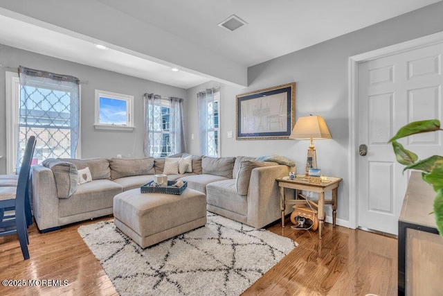 19 Gravelly Point Rd, Highlands, NJ 07732 - living room with wood finished floors, recessed lighting, and baseboards