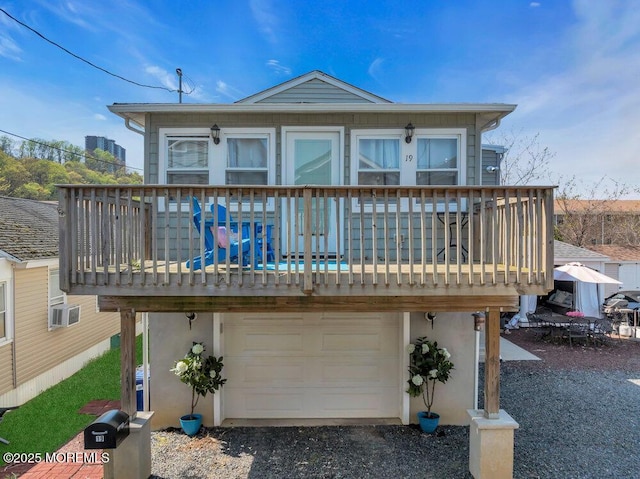 19 Gravelly Point Rd, Highlands, NJ 07732 - rear view of property featuring a garage, a wooden deck, stucco siding, and cooling unit