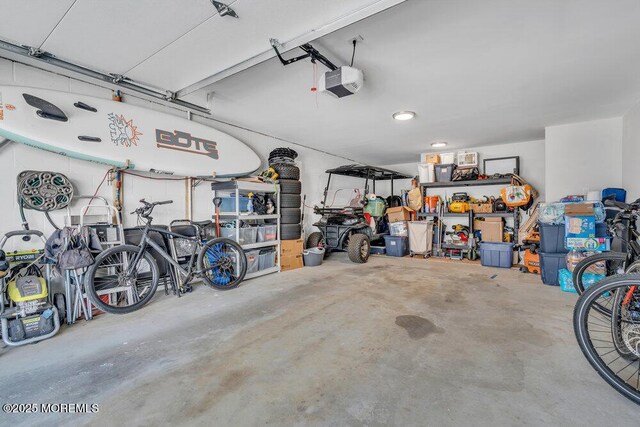 19 Gravelly Point Rd, Highlands, NJ 07732 - garage featuring a garage door opener and recessed lighting