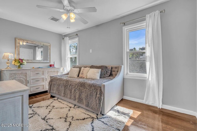 19 Gravelly Point Rd, Highlands, NJ 07732 - bedroom with wood finished floors, baseboards, and ceiling fan