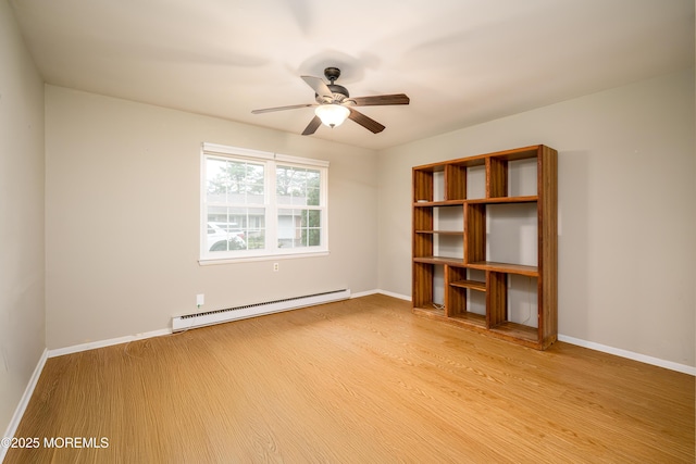 unfurnished room with a baseboard heating unit, light wood-type flooring, a ceiling fan, and baseboards
