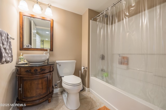 bathroom featuring shower / tub combo, vanity, baseboards, tile patterned floors, and toilet