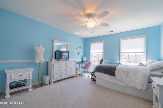 bedroom featuring a ceiling fan, carpet flooring, and visible vents