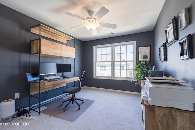 office area with visible vents, baseboards, carpet floors, and ceiling fan