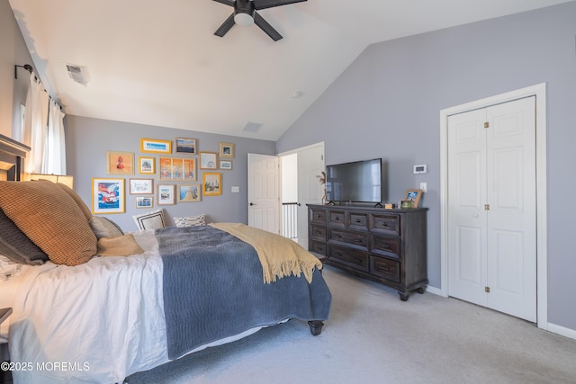 bedroom featuring ceiling fan, visible vents, light carpet, and high vaulted ceiling