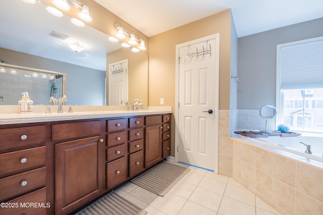 full bath with double vanity, tile patterned floors, visible vents, tiled shower, and a garden tub