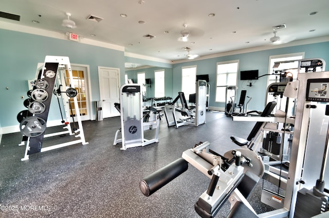 gym featuring visible vents, ornamental molding, and baseboards