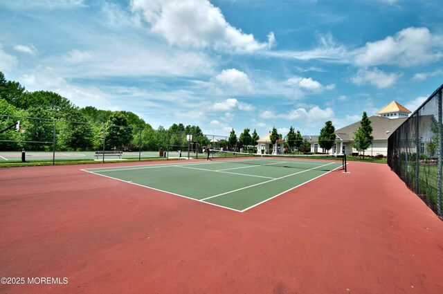 view of sport court with fence