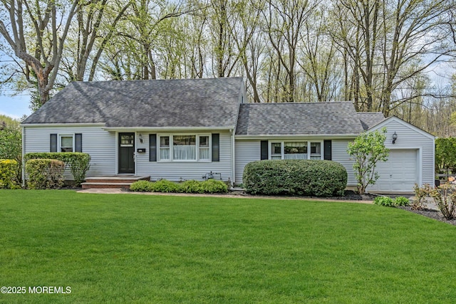 ranch-style house featuring a garage, a shingled roof, and a front yard