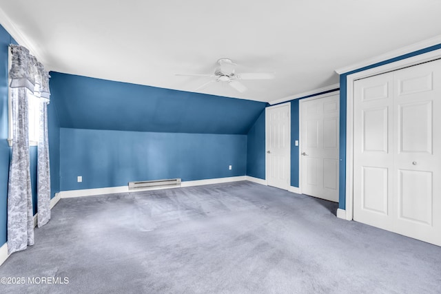 additional living space featuring a baseboard radiator, ceiling fan, baseboards, carpet flooring, and lofted ceiling