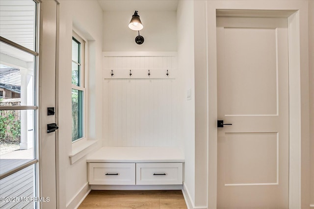 mudroom with baseboards and light wood-type flooring