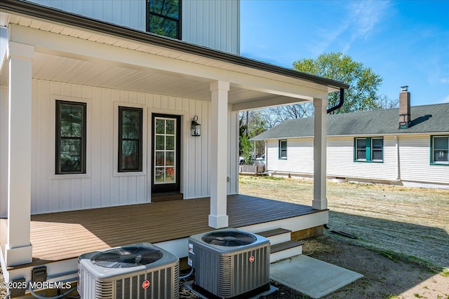 view of patio with central air condition unit and a wooden deck