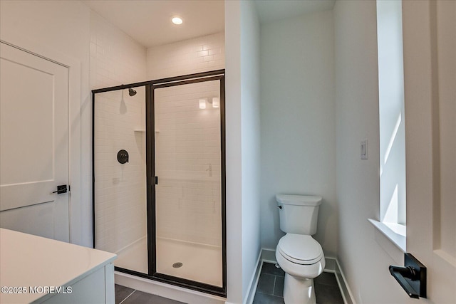 bathroom featuring tile patterned flooring, toilet, recessed lighting, baseboards, and a stall shower