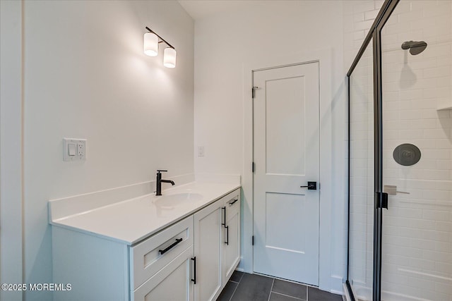 full bath featuring vanity, tile patterned flooring, and a stall shower
