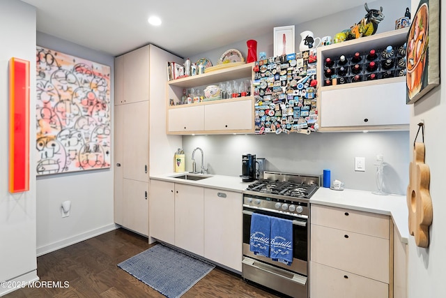 601 Bangs Ave Unit 908, Asbury Park, NJ 07712 - kitchen with open shelves, dark wood-style flooring, light countertops, stainless steel range with gas stovetop, and a sink