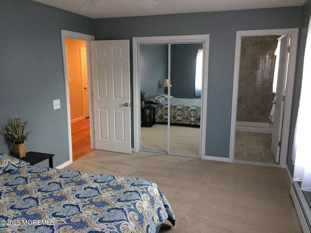 177 Pulaski Blvd, Toms River, NJ 08757 - carpeted bedroom with a baseboard heating unit, a closet, baseboards, and ensuite bath