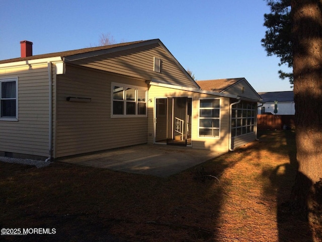177 Pulaski Blvd, Toms River, NJ 08757 - back of house featuring a chimney and a patio