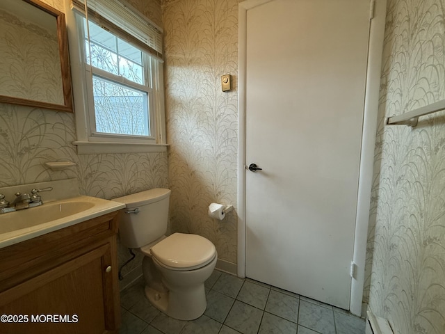 bathroom featuring toilet, tile patterned floors, wallpapered walls, and vanity