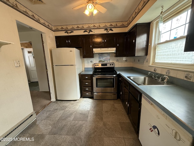 kitchen featuring ceiling fan, white appliances, baseboard heating, under cabinet range hood, and a sink